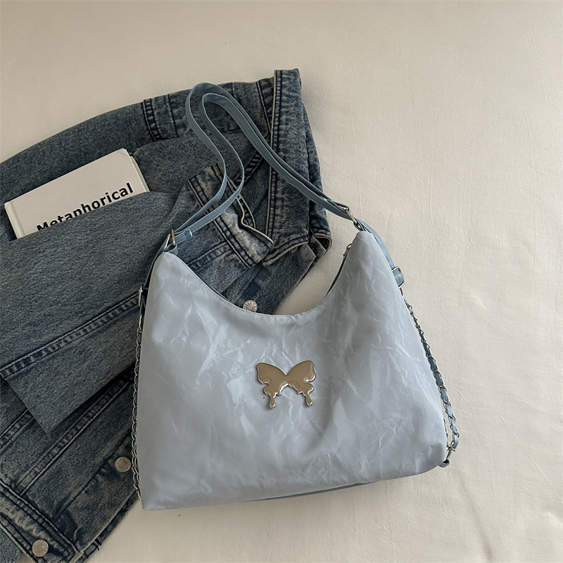 Mochila de moda de mariposa coreana 2024 nuevo bolso de mensajero de un solo hombro de cadena para estudiantes en clase bolso de alta capacidad