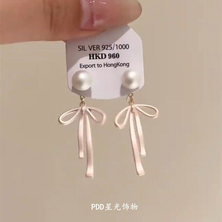 Elegant earrings with bow pearl