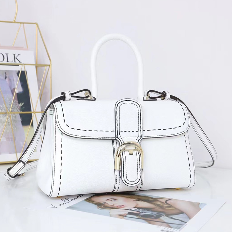 Bolso de mano con hebilla de herradura, modelo nuevo de 2025, bandolera de cuero de vaca granulado de primera capa, bolso de sillín informal y versátil.