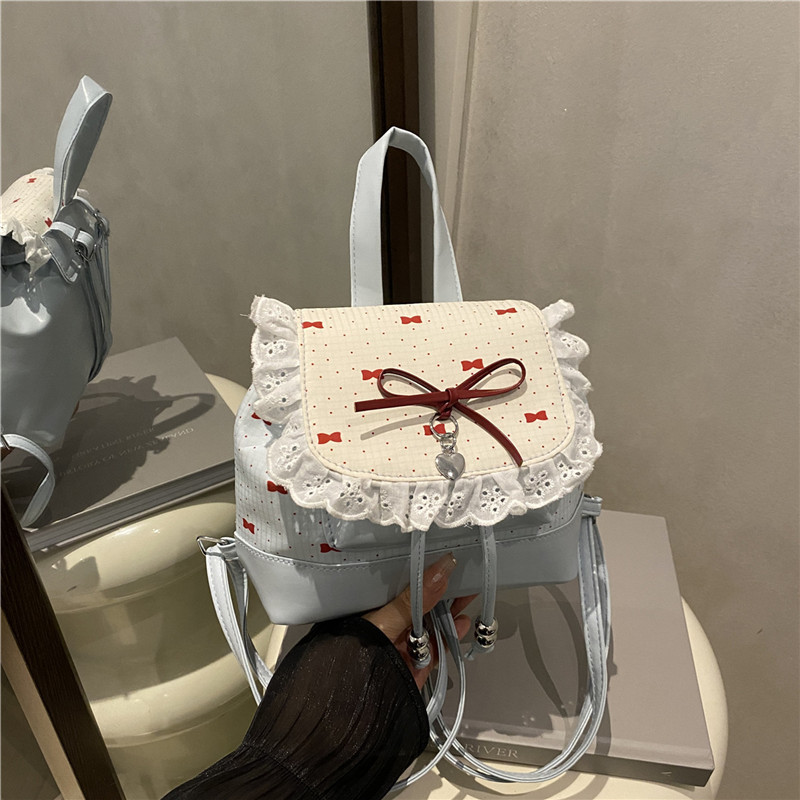 Bolsa de mano de moda coreana de chicas 2025 nuevo encaje de alto valor de la cara, mochila de hombro versátil
