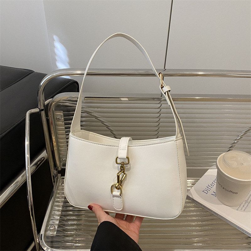 Textura de la bolsa de hombro de la mujer de la primavera de 2025 nueva bolsa de mochila en el temperamento elegante bolso cuadrado