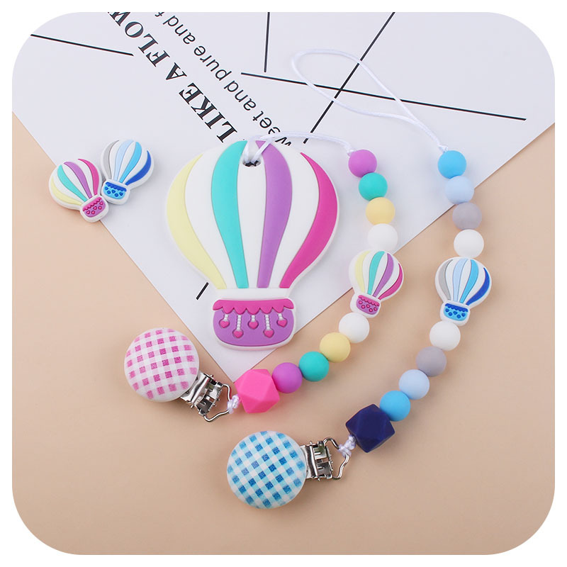 Nuevo bebé dibujos animados globo de aire caliente pulsera de silicona teether palo pezón cadena anti-gota cadena juguete teether