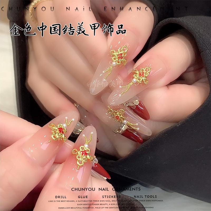 Nuevos joyas de uñas de oro de China marcha nacional con diamantes rojos accesorios de uñas de Año Nuevo taladro
