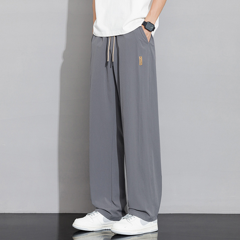 Pantalones casuales recto de tamaño grande para hombres 2026 nuevo verano delgado hielo suelto para aumentar el peso de los pantalones deportivos para hombres