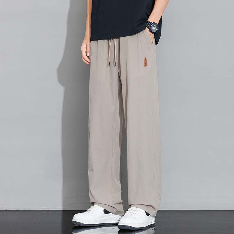Pantalones casuales recto de tamaño grande para hombres 2026 nuevo verano delgado hielo suelto para aumentar el peso de los pantalones deportivos para hombres