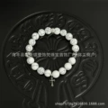 White stone-four beads cross