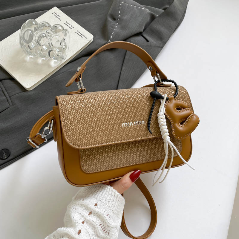 Textura al por mayor de lujo ligero bolso de mano bolso de mujer otoño 2025 nuevo estilo extranjero empalme bolso de hombro bolso de viaje