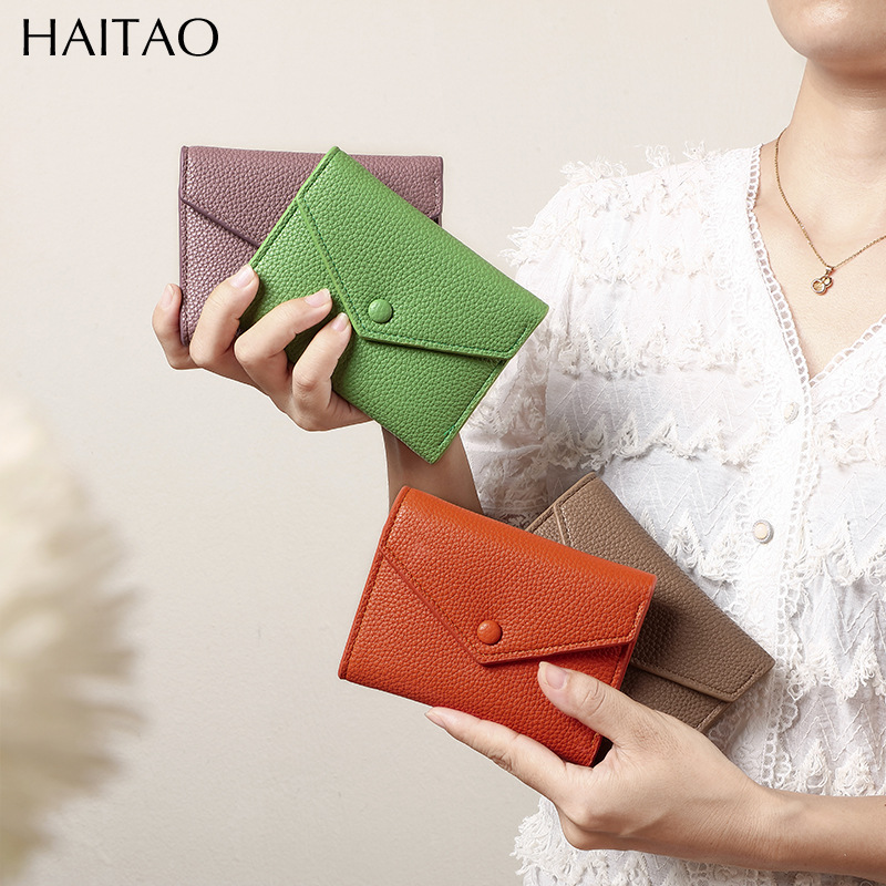 Cartera de mujer corta simple cartera plegable de tres pliegues japonesa y coreana de moda nuevo sobre bolso de cambio transfronterizo