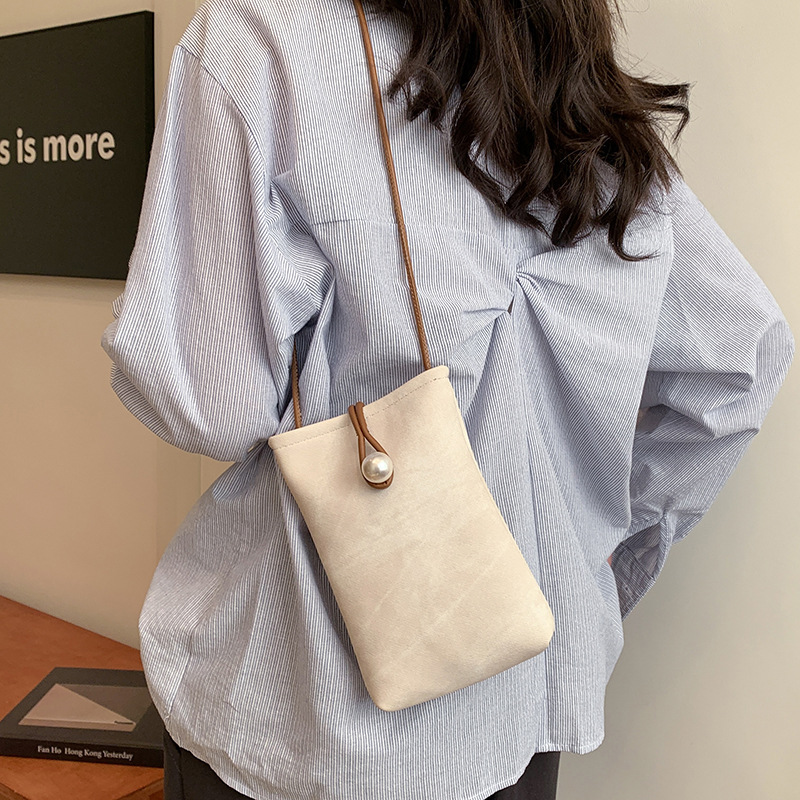 Teléfonos móviles de nicho de alta gama en primavera y verano con bolsos pequeños para mujeres 2025 nueva billetera de cuero blanco simple de un solo hombro