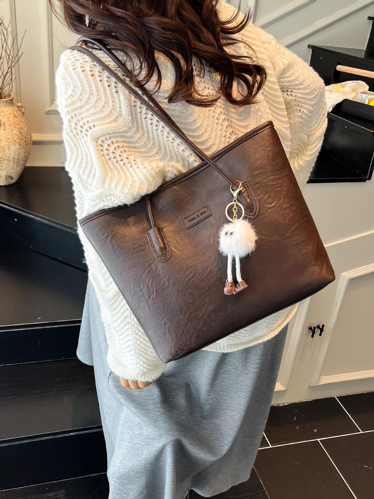 Transfronterizos más vendidos ocio simple bolso de gran capacidad 2025 nuevo producto explosivo bolso de hombro retro bolso de brazo de viaje