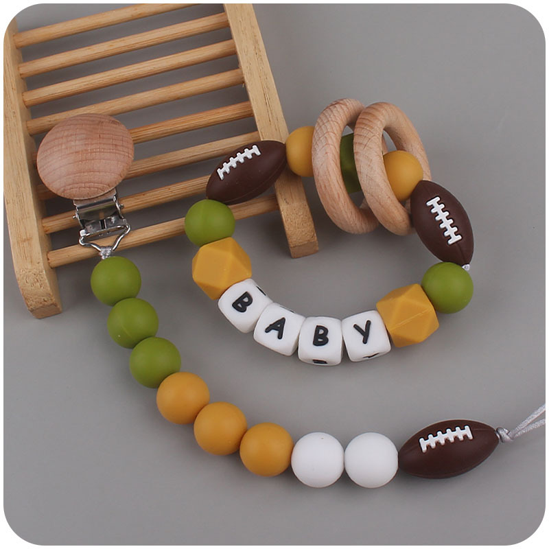 Nuevo bebé suministros de dibujos animados rugby mordedor chupete cadena calmante bebé DIY pulsera mordedor conjunto de dos piezas