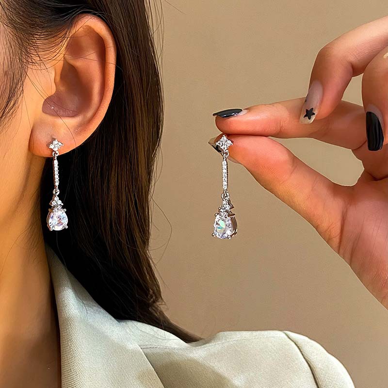 White elegant universal geometric earrings with zircon drop-shaped