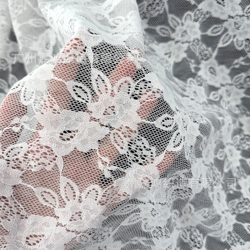 Primavera y verano nueva tela de encaje brocado amoniaco flores elásticas encaje hacer camiseta base vestido tela de encaje