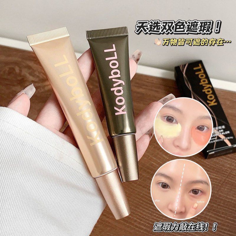 Kodyboll bicolor eye concealer líquido ligero hidratante para cubrir los círculos oscuros de los ojos, ranura de lágrimas impermeable para mantener el maquillaje concealer