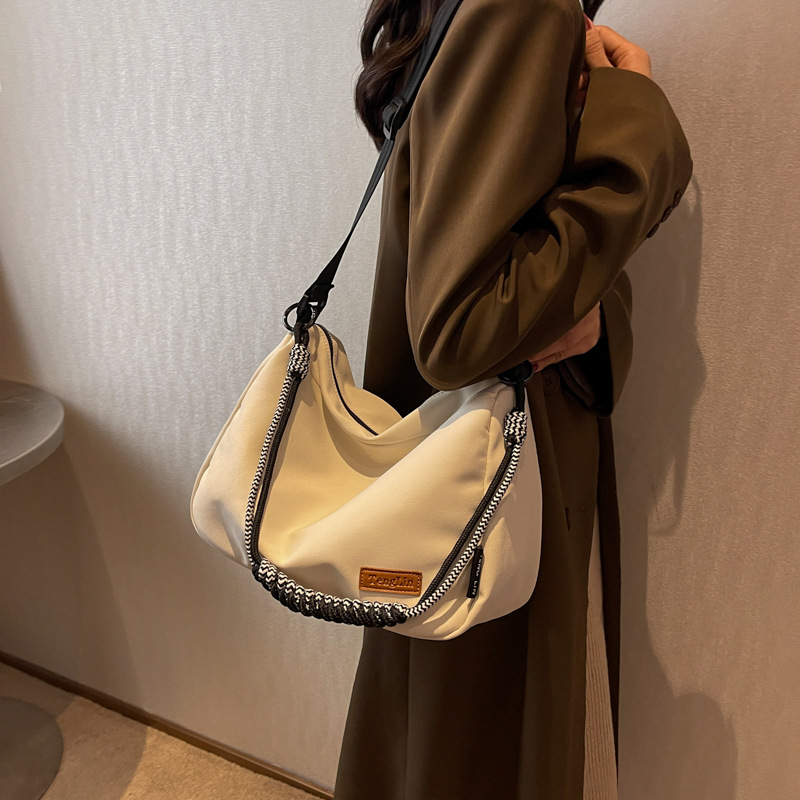 Large-capacity crossbody canvas bag for women 2023 new style, versatile and casual single-shoulder pillow bag for commuting to school on Instagram undefined