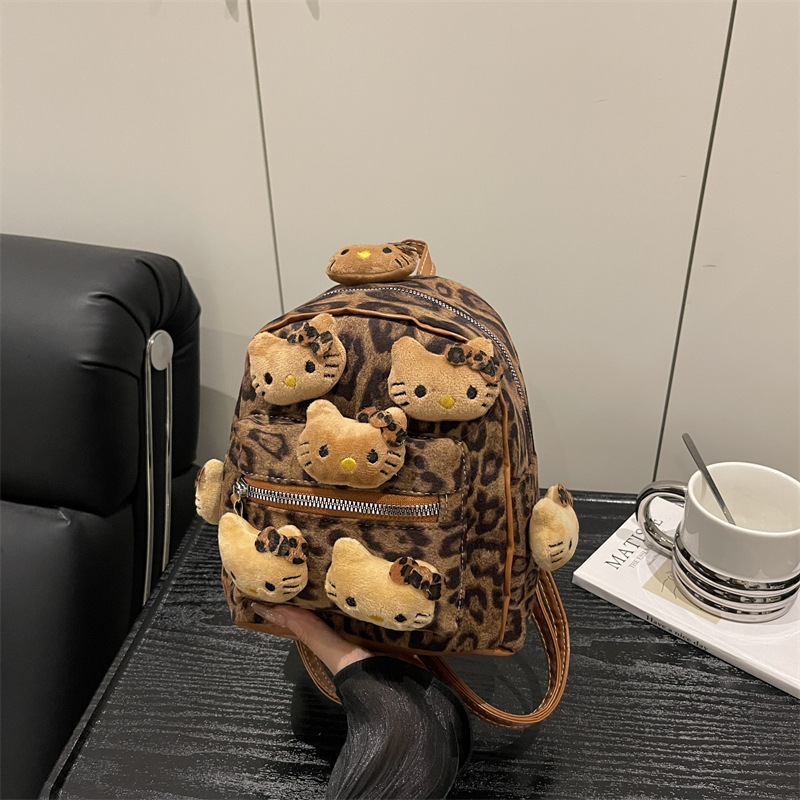 Nicho Hot Girl nueva mochila de dibujos animados con patrón de leopardo para almacenar mochila de peluche de viaje al aire libre