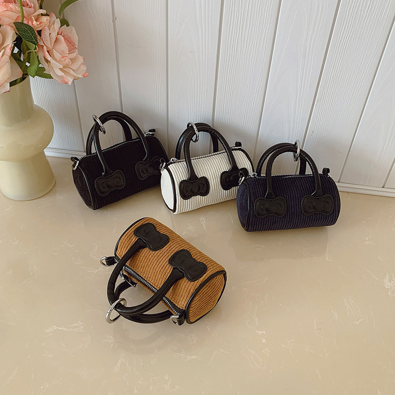 Otoño y invierno nuevo tipo de bolso de niños de ternero mini exquisita bolso de hombro para hombres y mujeres, moda popular para padres e hijos bolso de cubo de agua