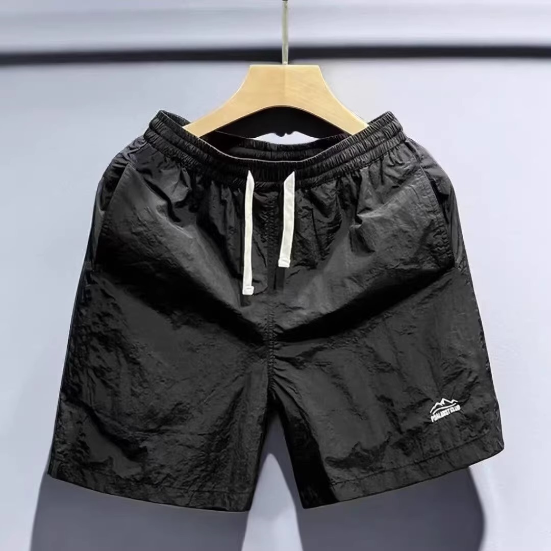 Verano al aire libre montañas y ríos pantalones cortos de color sólido para hombres pantalones de cinco puntos de playa sueltos de secado rápido comercio exterior al por mayor transfronterizo