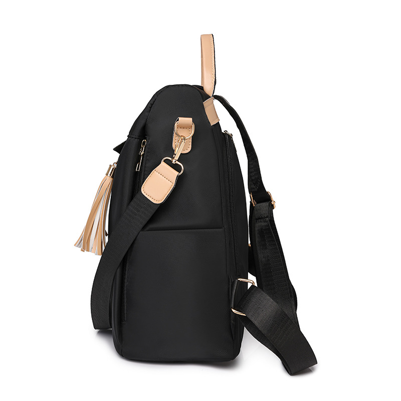 Mochila de nailon ligera casual de moda para mujer nuevo estilo de viaje anti-salpicaduras de agua, resistente al desgaste, antirrobo, mochila de viaje coreana de moda