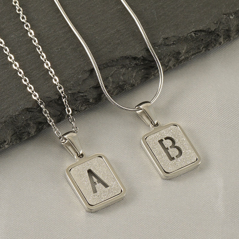 New fashion stainless steel English letter pendant factory wholesale pressure sand letter titanium steel 18k commuter Joker