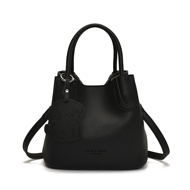 Bolso de patrón de lichi de alta gama para damas 2025 verano nuevo bolso de mensajero popular de todo fósforo bolso de cubo portátil de moda