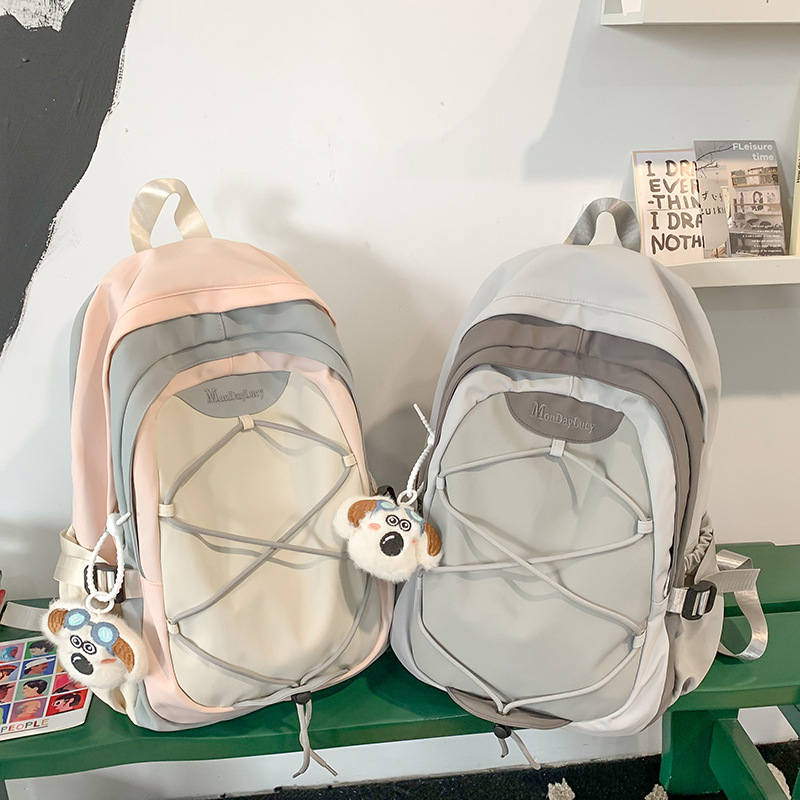Estilo al aire libre, mochila a pie, mochila ligera de nicho, mochila gris de alta calidad para niñas de secundaria