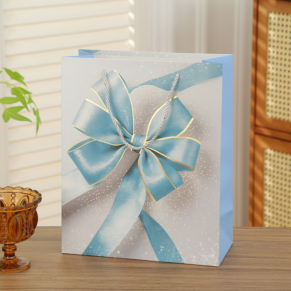 Bolsas de regalo de San Valentín bolsas de embalaje de arco bolsas de regalo de vacaciones Qixi papel cartón blanco estampado bolsas al por mayor