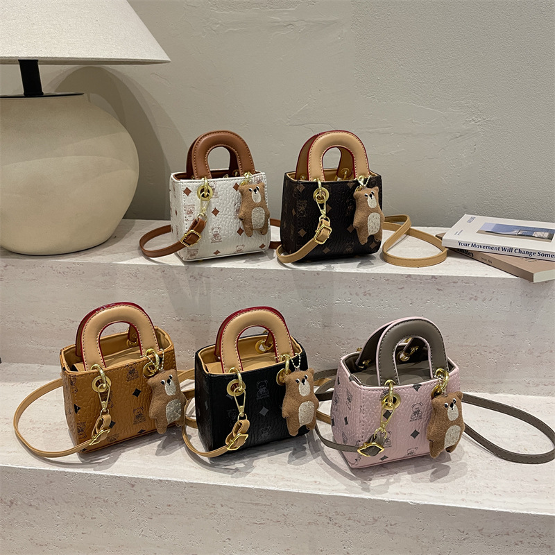 2026 nuevo bolso infantil caricatura lindo oso impresión bolso de hombro de moda mini bolso de bebé