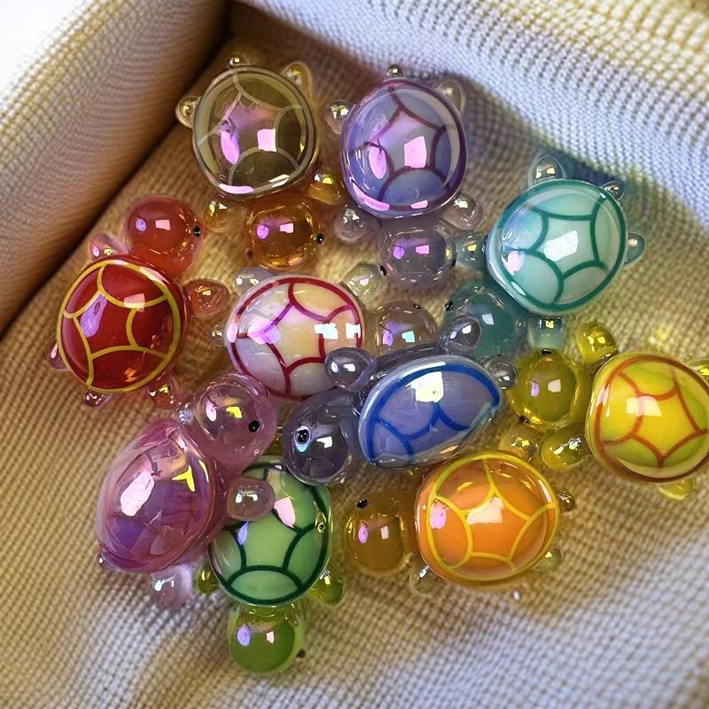 Galvanoplastia de color luminoso tortuga celebridad de la red tortuga bolsa ciega resina accesorios de dibujos animados resina bricolaje decoración de coche péndulo X20