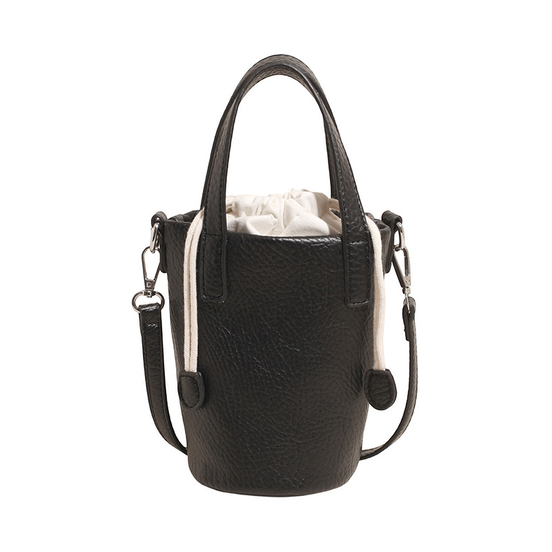 Bolso de cubo de moda coreana 2025 verano nuevo bolso femenino bolso de hombro con patrón de lichi fresco bolso de mensajero simple y versátil