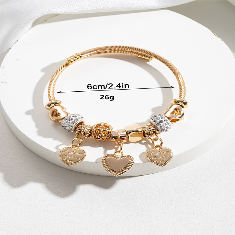 Panjia pulsera Dora DIY cuentas transfronterizas explosión de aleación en forma de corazón tallado colgante de letras de acero inoxidable brazalete de bola de perforación