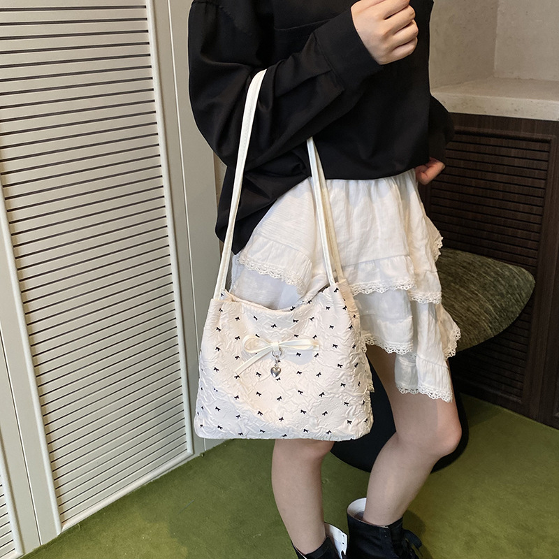 Bolso de axila de moda coreana 2025 verano nuevo bolso femenino lindo lazo bolso de hombro de color de contraste de estilo occidental