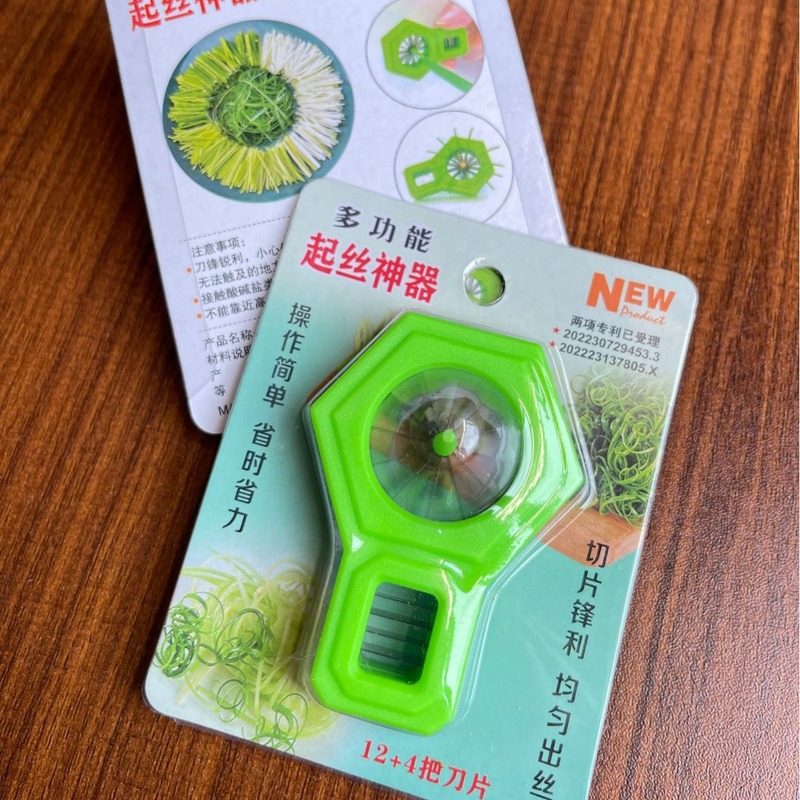 ステンレスのネギの糸は家庭用の台所の唐辛子の糸を切って創意的な道具を切ります。|undefined