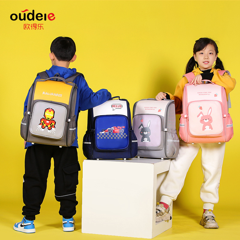 歐得樂新款學生減負書包新款輕便透氣小學3-6年級PU+牛津布雙肩包