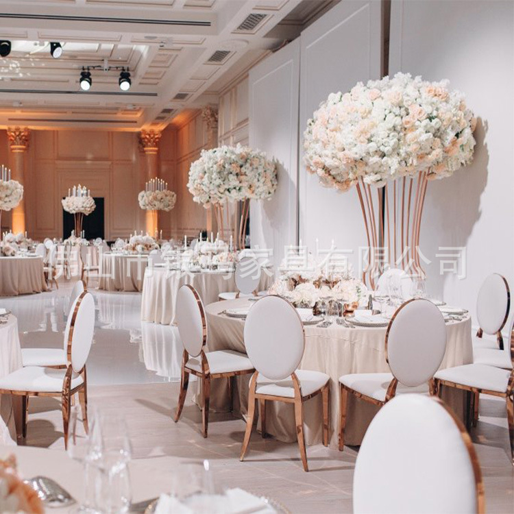 Fábrica al por mayor Hotel banquete boda comedor silla boda galvanoplastia Silla de acero inoxidable Bolsa De Oro suave Silla de comedor de cuero