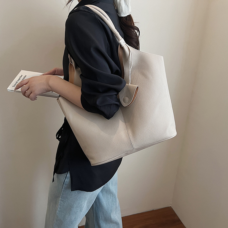 Versión coreana del bolso de alta capacidad 2025 nuevo bolso de cubo de todo fósforo de moda bolso de hombro simple bolso de axila de color sólido