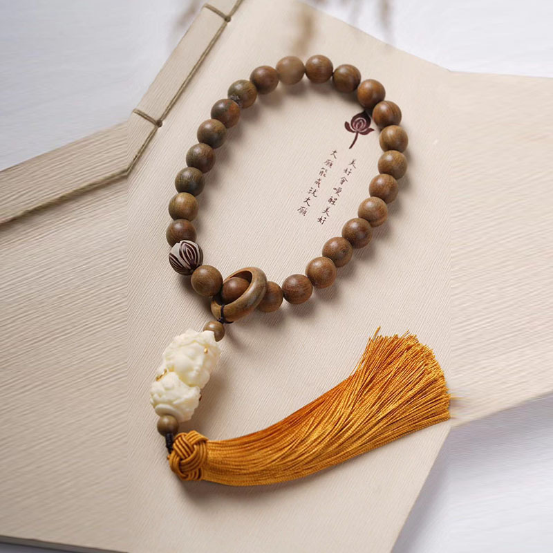 Rosary with round beads green sandalwood walnut