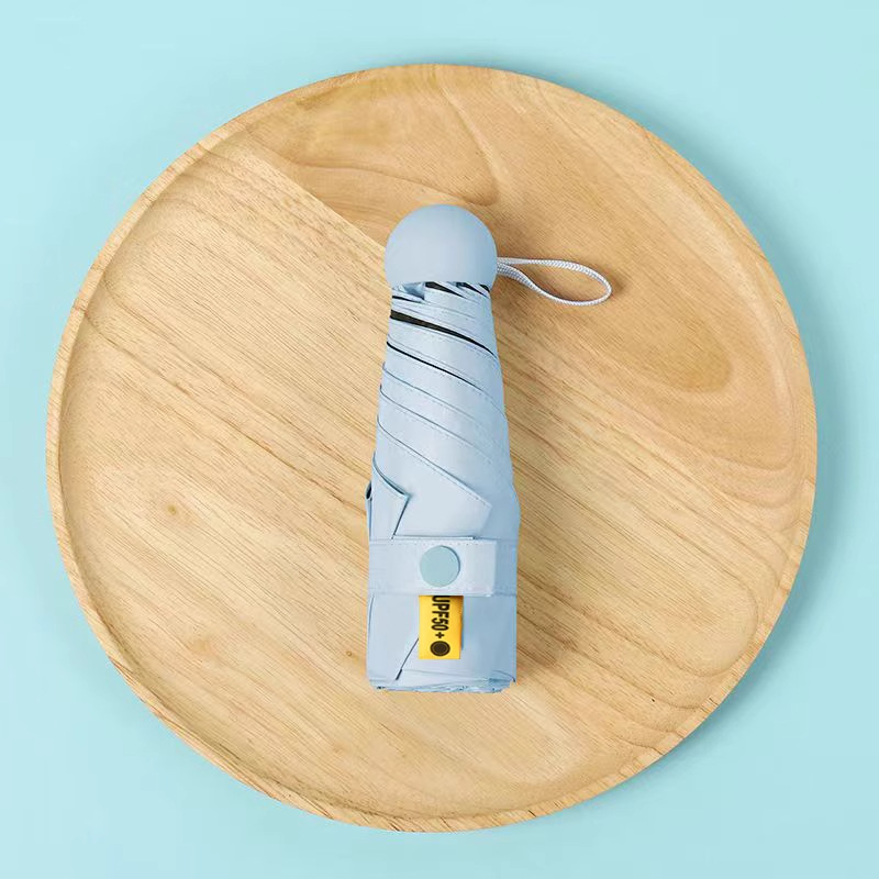 50% de descuento sol y lluvia paraguas de protección solar paraguas de sol UV portátil compacta cápsula sombrilla personalizada