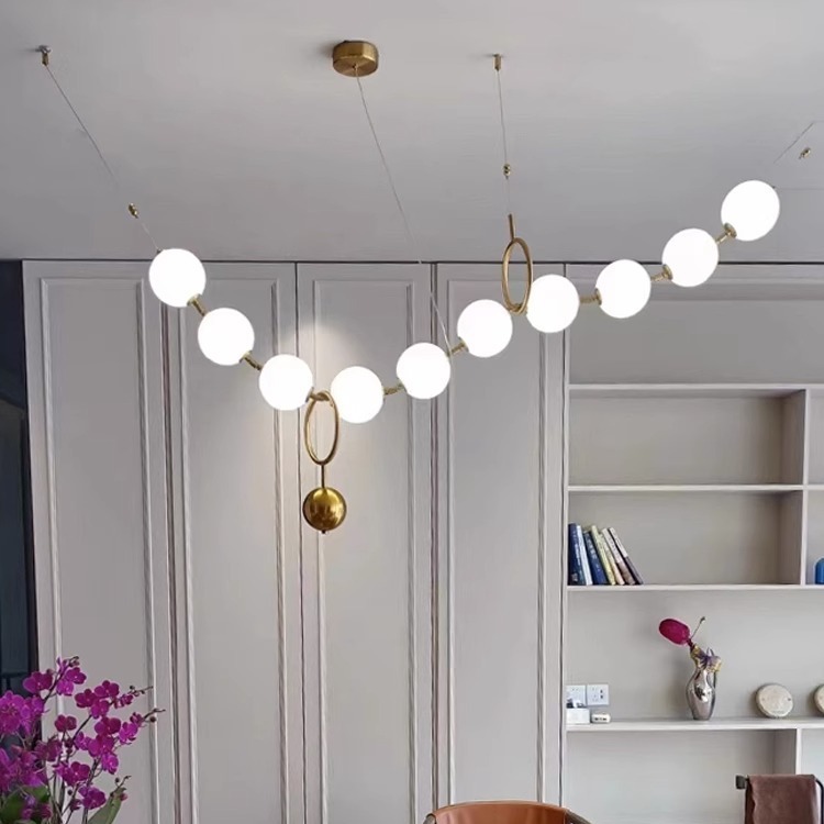 Luz francesa del restaurante de frijoles mágicos moderno simple bronce collar de perlas lámpara de bar largo loft Buda perlas lámpara de bar