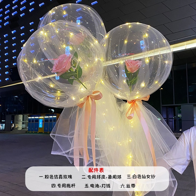 光る夜市の円形の赤い屋台のネットを並べてボールを押して会の風船のイルミネーションの明かりの告白のロマンチックな波の地帯のスーツを押します。|undefined