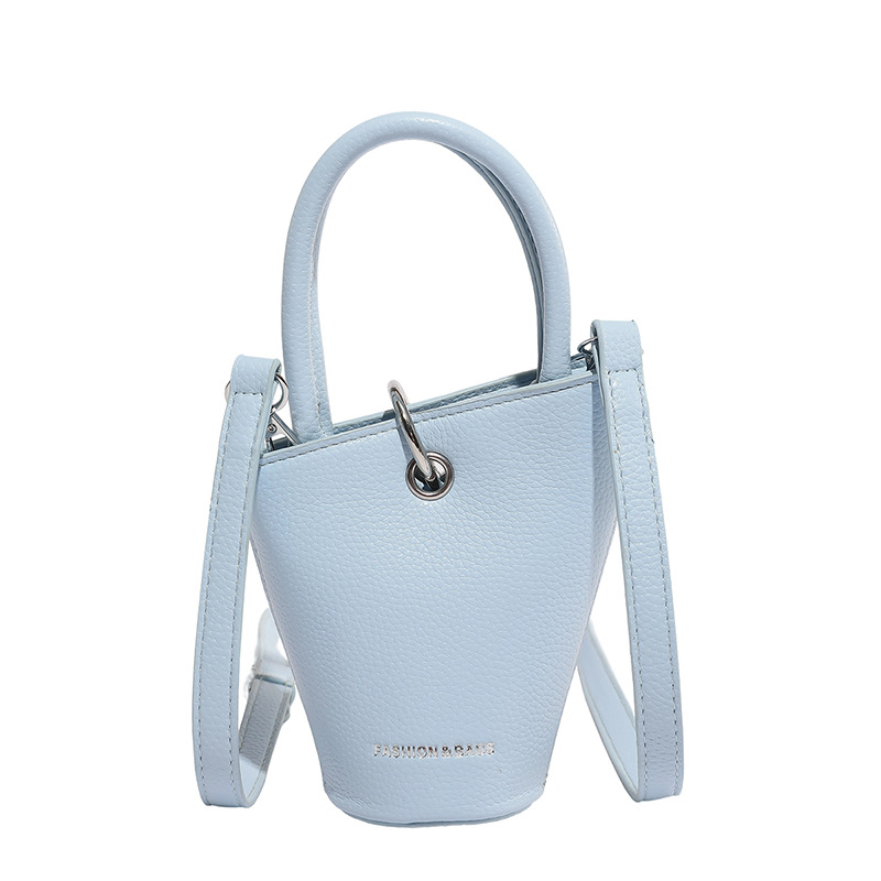 Bolso de cubo de diseño de nicho 2025 verano nuevo bolso de hombro con patrón de lichi mini bolso de mensajero de letras mujer