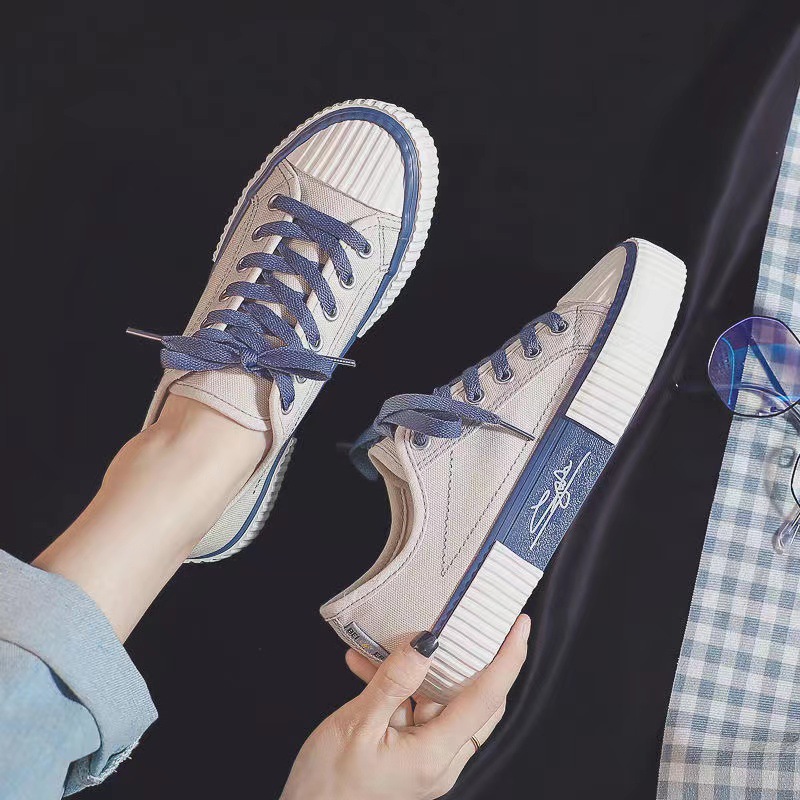 2023 primavera y otoño nuevos zapatos de lona estudiantes femeninos zapatos de tablero con cordones zapatos de galletas zapatos transpirables zapatos casuales de mujer zapatos blancos