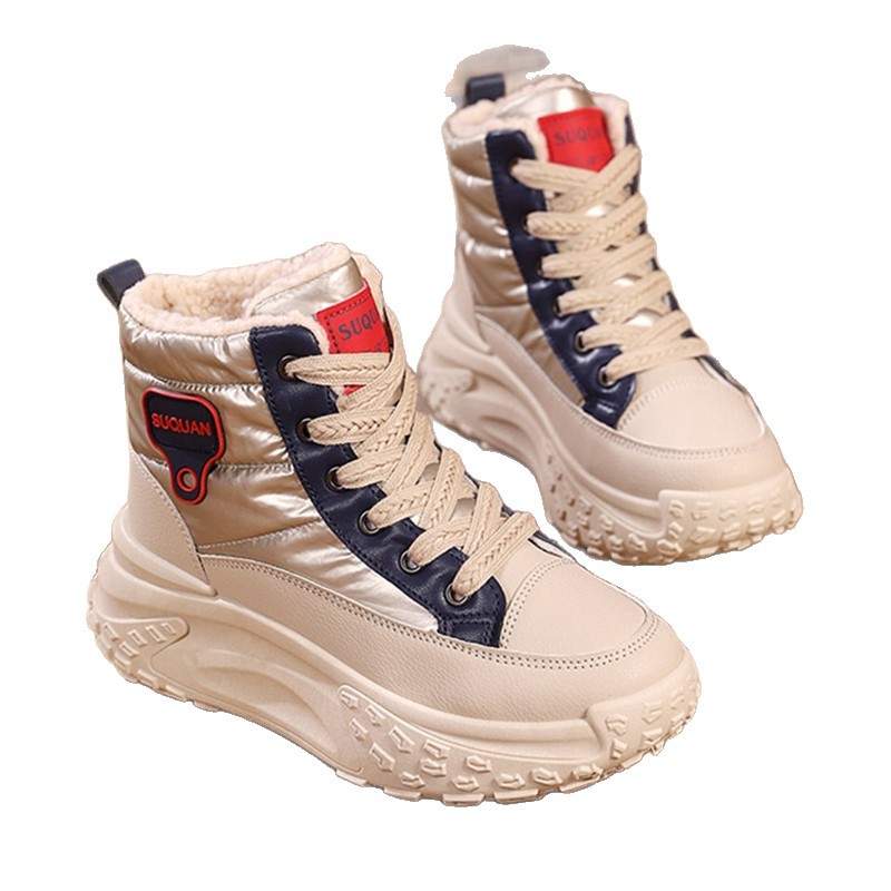 Botas de nieve de invierno de mujeres 2025, una nueva piel en una calentadora zapatillas deportivas cómodas y zapatos de algodón gruesos para mujeres