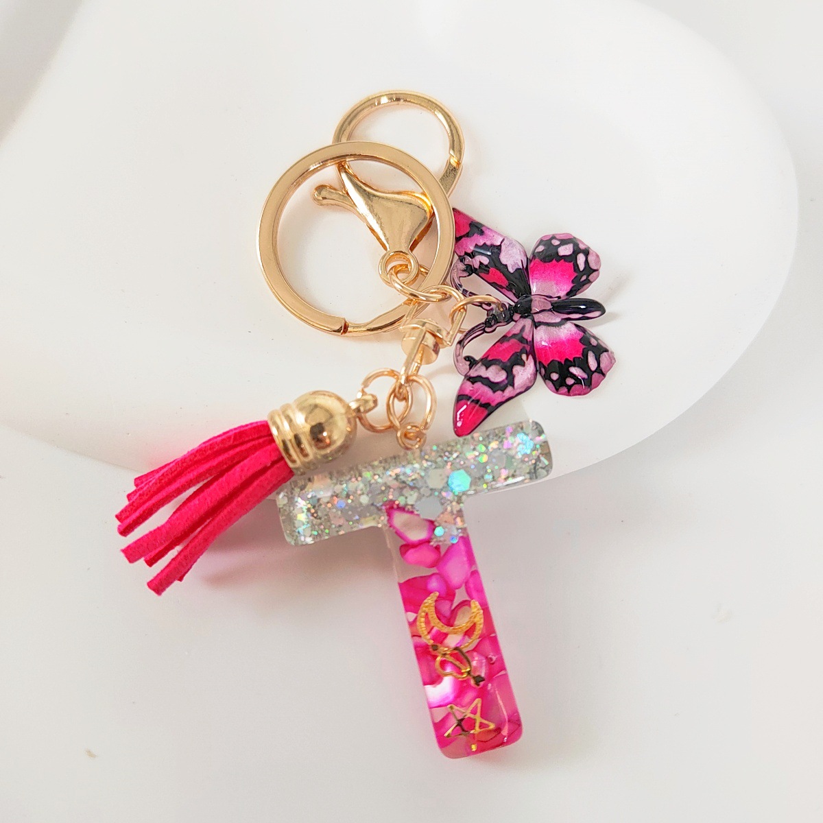 Inventario transfronterizo nueva resina bicolor mariposa borda llavero colgante estrella luna accesorios de joyas