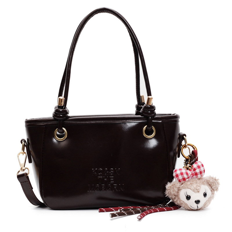 Bolsa de cubo retro explosiva para mujeres 2025 nuevo bolso de nicho de diseño de alta humedad versátil bolso de hombro