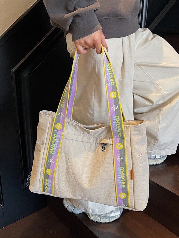 Bolso Tote portátil horizontal de tela de nailon para mujer 2025 nueva moda casual todo fósforo bolso de hombro de trabajo
