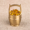 Brass jewelry, golden water, table bucket