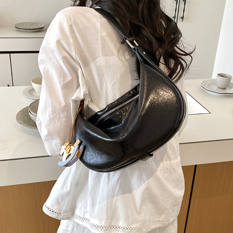 Este año, bolsas de bolinillos populares y simples para mujeres 2026 nuevas texturas diarias de mochila de viaje, bolsas personales de ropa de cama casuales