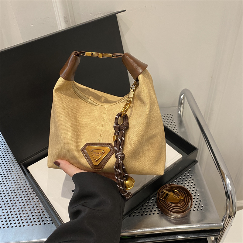 2025 nueva sensación de retro bolsos de mujer moda moda textura bolsos de hombro coreanos populares mochila de viaje