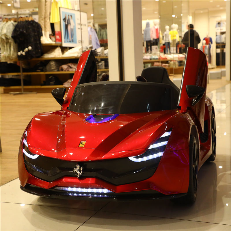 Children's electric car, four-wheeled remote control car for boys and girls, music-enabled, rechargeable, self-driving battery-powered toy car.